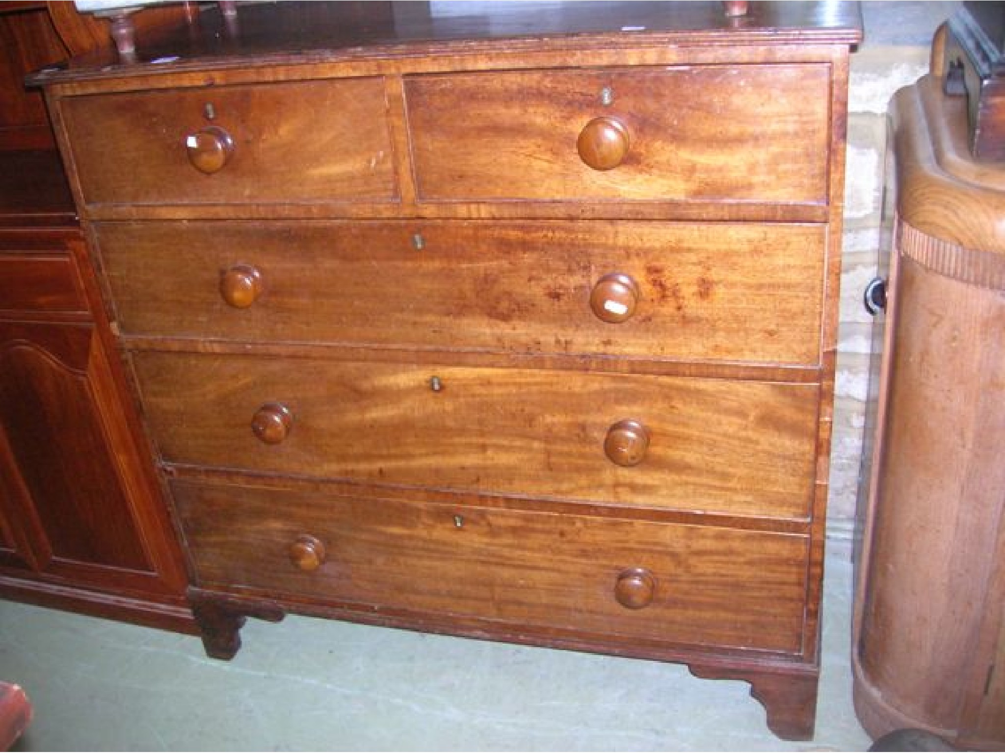 Appraisal: A th century mahogany bedroom chest of three long and