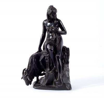 Appraisal: A patinated figure of a girl with a goat cm