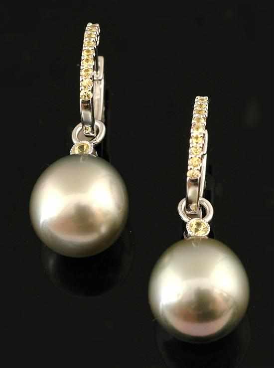 Appraisal: A pair of Tahitian pearl and sapphire earrings Each earring