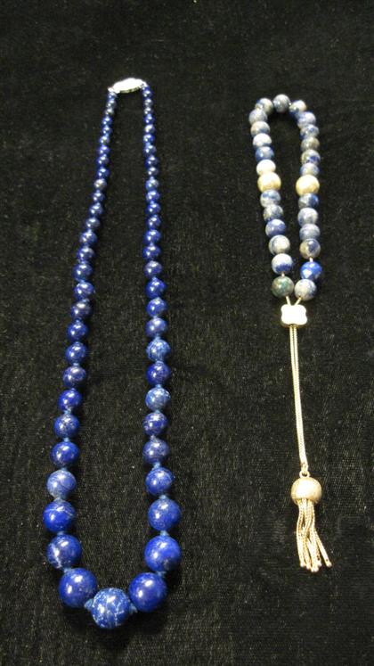 Appraisal: Two lapis bead necklacesShort necklace strung on karat box link