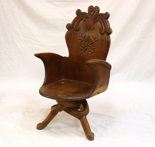 Appraisal: Unusual hand carved chair with three naturalistic interwoven legs spoon