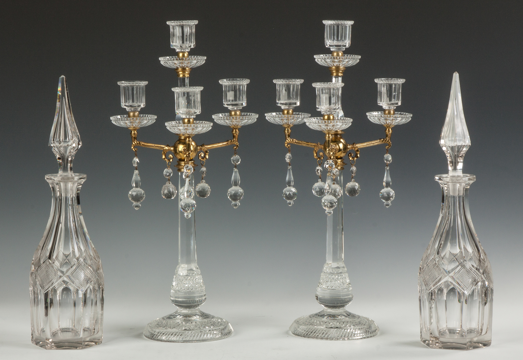 Appraisal: European Cut Glass and Brass Four-Light Candelabras th century