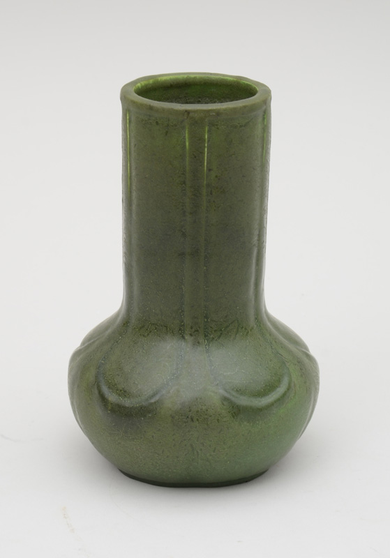 Appraisal: GRUEBY GREEN-GLAZED POTTERY BOTTLE VASE With rubbed impressed mark and