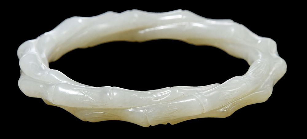 Appraisal: Chinese Carved Jade Bamboo Form Bangle mutton fat color in