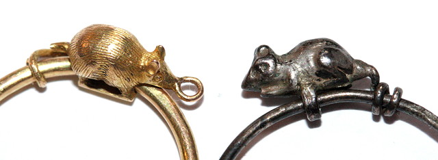 Appraisal: A GOLD RING with attached mouse a silver version and