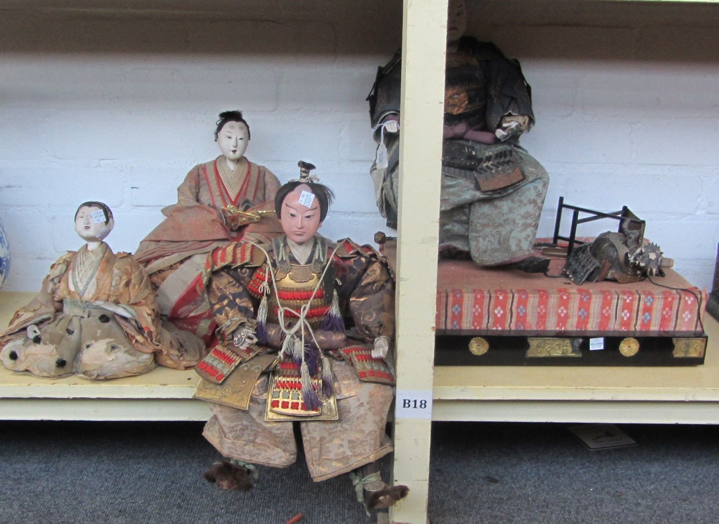 Appraisal: Two Japanese papier-m ch dolls th century each modelled and