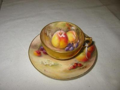 Appraisal: A ROYAL WORCESTER PORCELAIN CUP AND SAUCER the interior painted