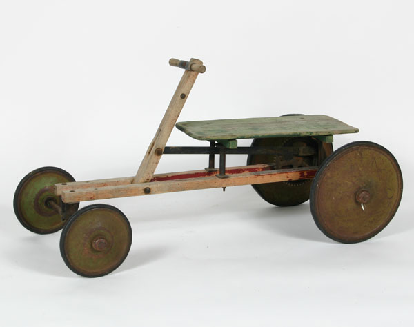 Appraisal: Children's riding toy with metal wheels and rubber tires Traces