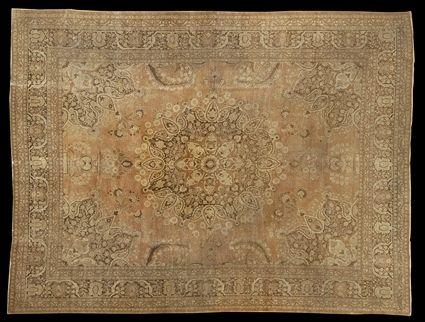 Appraisal: TABRIZ MEDALLION CARPET The fawn and brown medallion anchored to