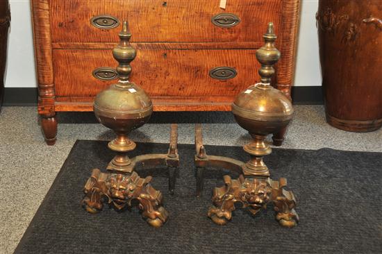 Appraisal: PAIR OF ANDIRONS Cast brass andirons with lion's heads and