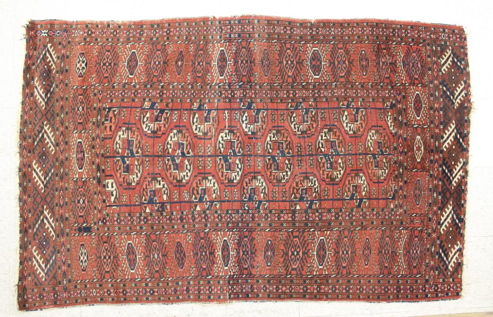 Appraisal: SEMI-ANTIQUE PERSIAN TURKMAN BOKHARA AREA RUG centering a rectangular field