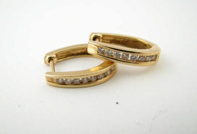 Appraisal: Pair of K yellow gold hoop huggie earrings with channel-set