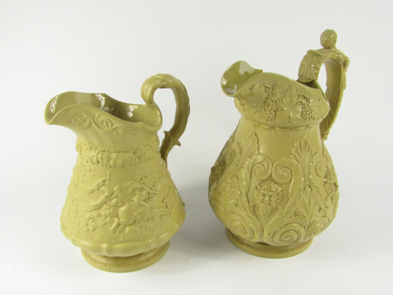 Appraisal: A Ridgway mid thC buff stoneware jug relief decorated in