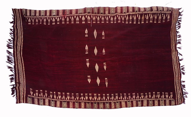 Appraisal: A NORTH AFRICAN DARK RED GROUND SHAWL with white stylised