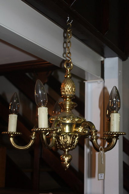 Appraisal: A GILT METAL FIVE BRANCH CHANDELIER the column with pineapple