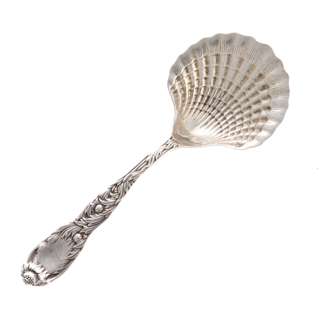 Appraisal: Sterling silver serving spoon with shell bowl in the Chrysanthemum