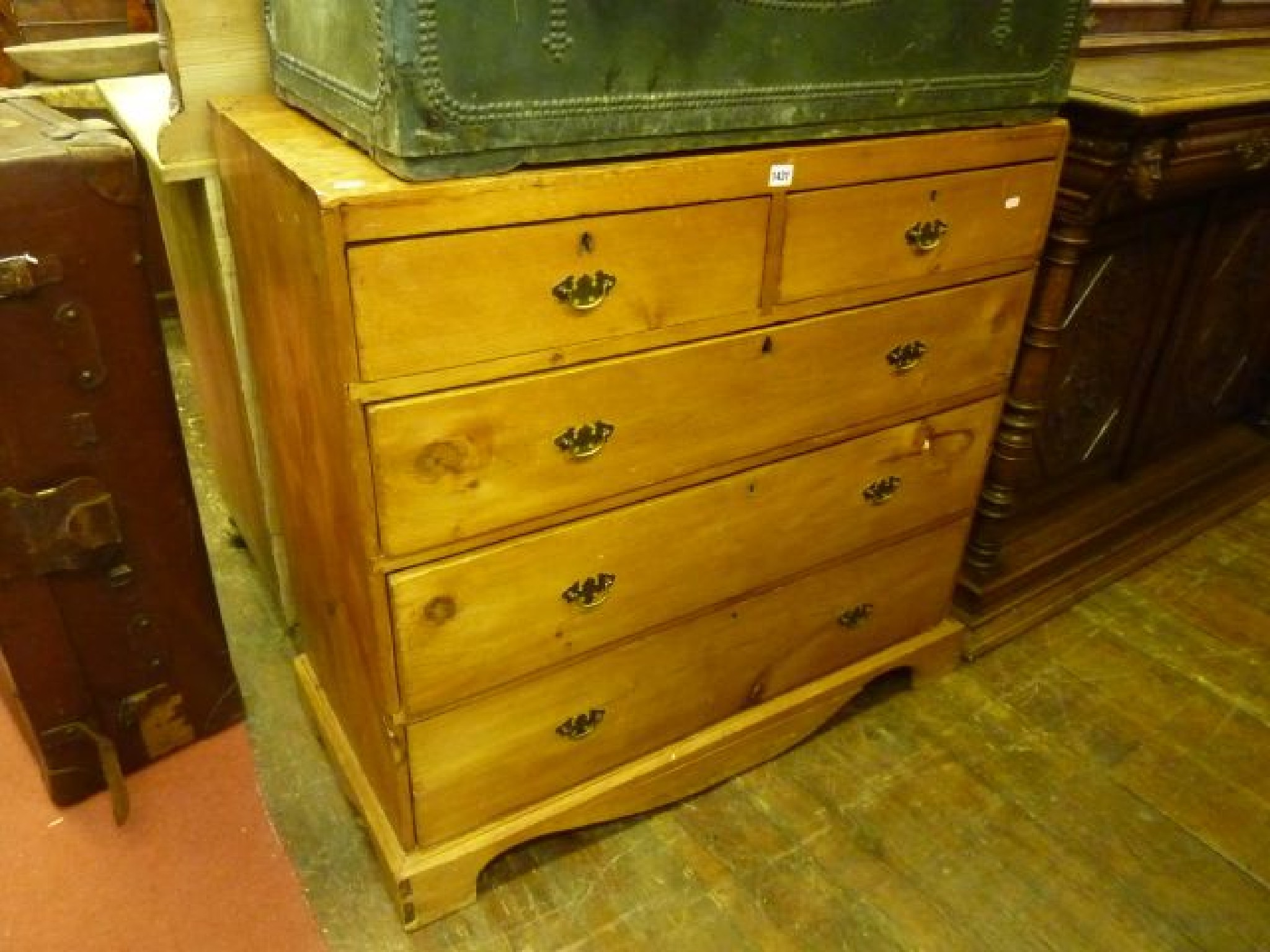 Appraisal: A stripped and waxed pine chest of three long and