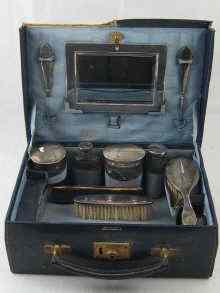 Appraisal: A leather vanity case fitted with eleven silver mounted items