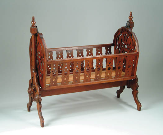 Appraisal: VICTORIAN WALNUT TWO PART SWINGING CRADLE The cradle having eight