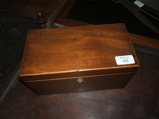 Appraisal: A George III mahogany and satinwood tea caddy wide