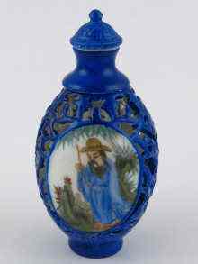 Appraisal: A hand painted Chinese snuff bottle with pierced rotating outer