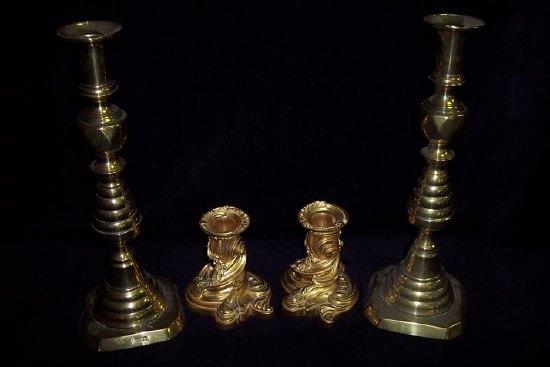 Appraisal: A pair of gilt metal candlesticks of squat scrolling Rococo