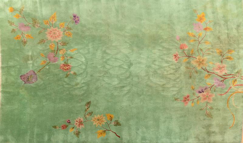 Appraisal: CHINESE WOOLWORK GREEN-GROUND CARPET Worked with flowering branches Approx ft