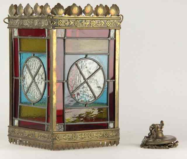 Appraisal: An Edwardian hanging lantern with embossed brass mounts and stained