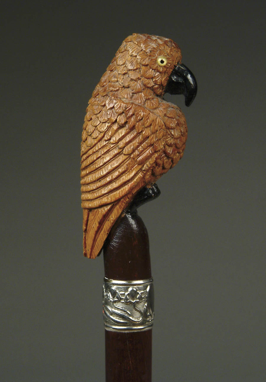 Appraisal: CARVED WOOD CANE WITH PARROT Parrot with glass eyes black