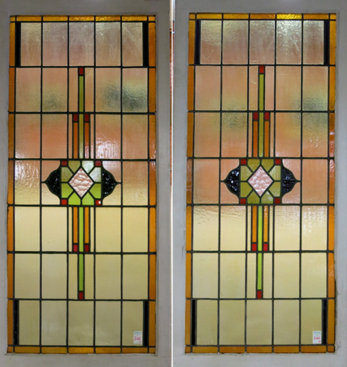 Appraisal: PAIR OF STAINED AND LEADED GLASS WINDOW PANELS The matching