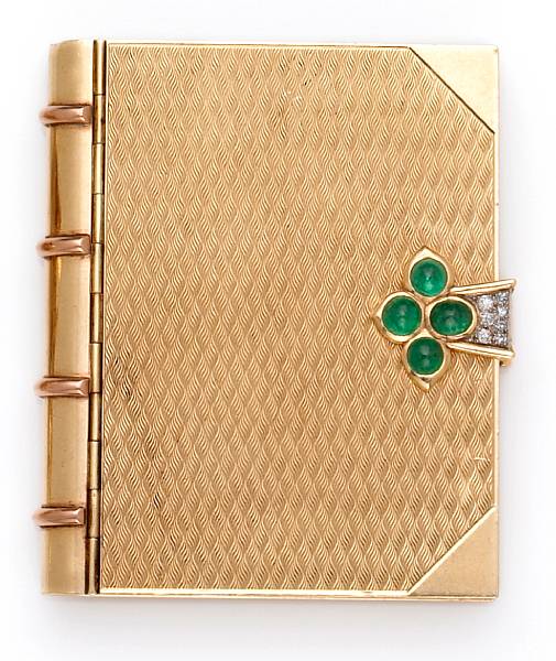 Appraisal: of book motif the clasp featuring round and oval-shaped emerald