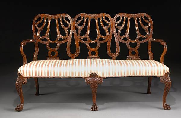 Appraisal: A George II style carved walnut sofa fourth quarter th