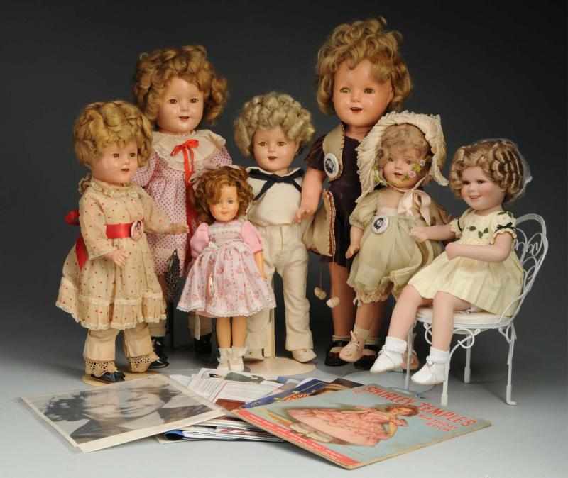 Appraisal: Lot of Shirley Temple Dolls Description New bisque Shirley sitting