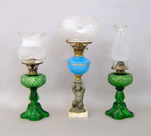 Appraisal: Pair of green glass table lamps together with a figural