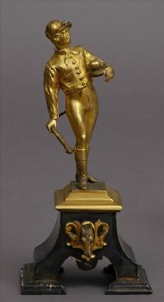 Appraisal: GILT-METAL FIGURE OF A JOCKEYModeled standing holding a crop and