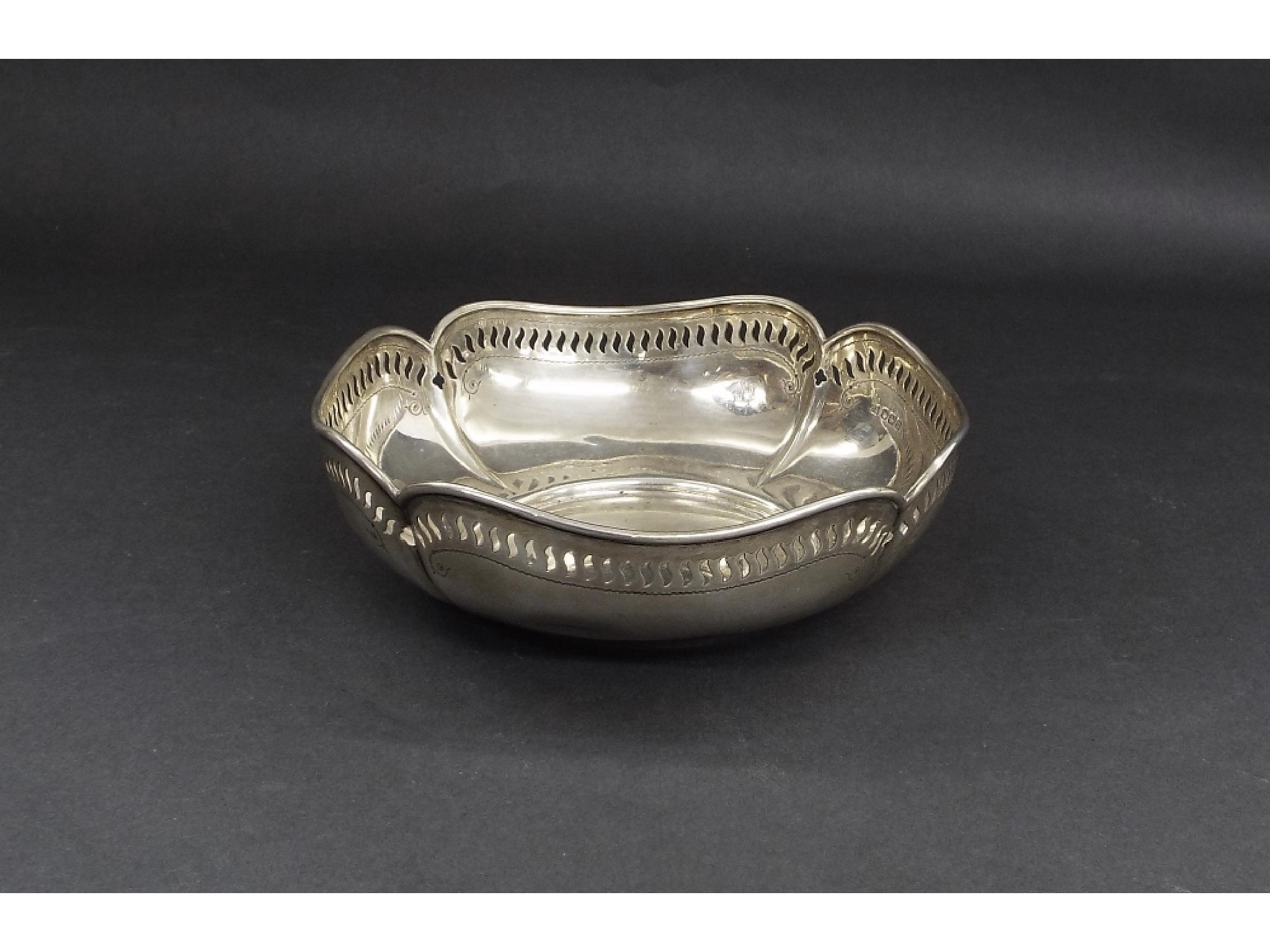 Appraisal: George V silver lobed fruit bowl with pierced wavy rim