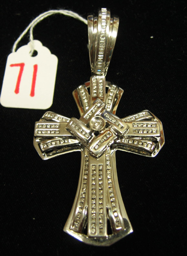 Appraisal: DIAMOND AND FOURTEEN KARAT WHITE GOLD CROSS PENDANT The large