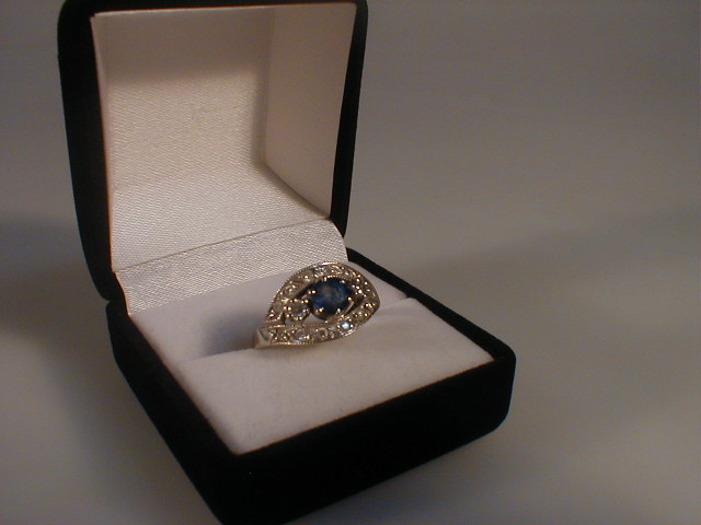 Appraisal: A diamond and sapphire set dress ring of a round