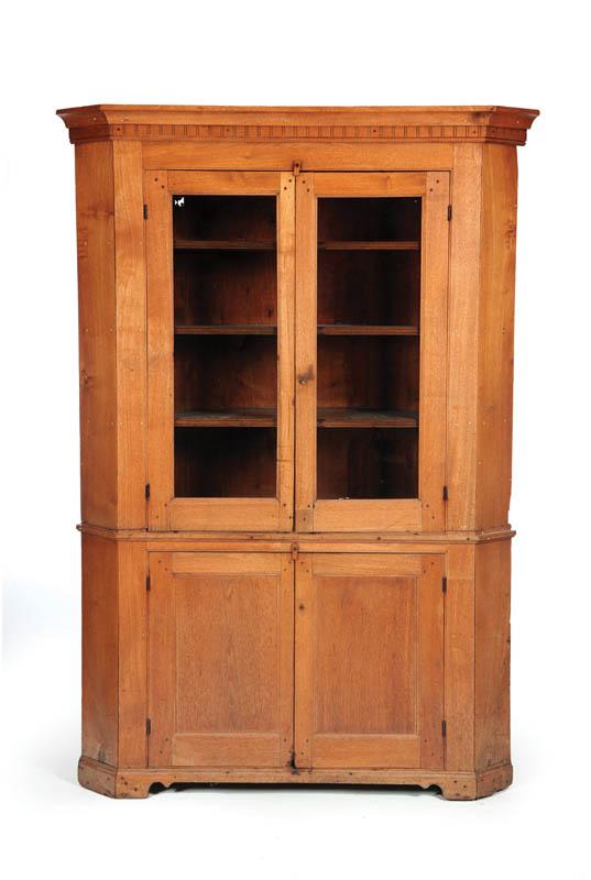 Appraisal: CORNER CUPBOARD American st half- th century walnut Two-piece solid