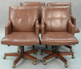 Appraisal: Set of four Councill leather armchairs having swivel bases Set