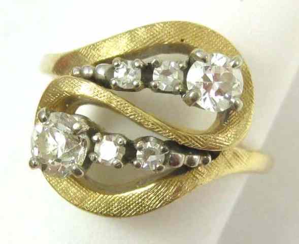 Appraisal: DIAMOND AND FOURTEEN KARAT GOLD RING set with six round-cut