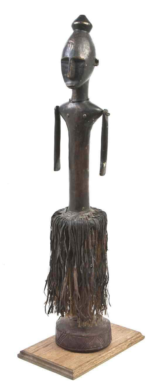 Appraisal: An African Wood and Metal Figure having reticulated arms and