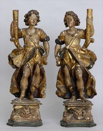 Appraisal: PAIR OF ITALIAN BAROQUE FIGURAL CANDLE HOLDERS Each carved as