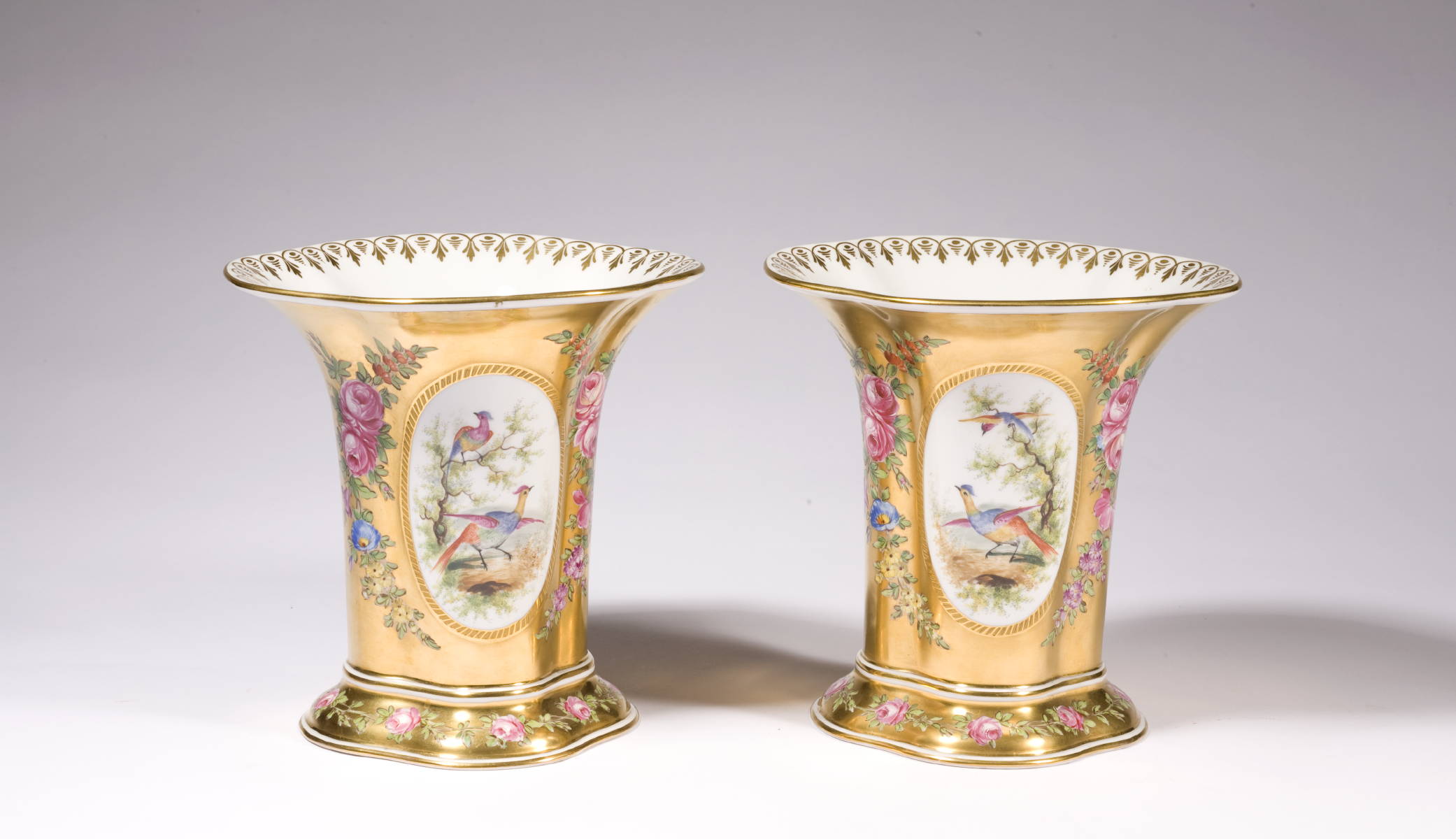 Appraisal: PAIR OF GERMAN PORCELAIN MANTLE VASES WITH GILT GROUND AND