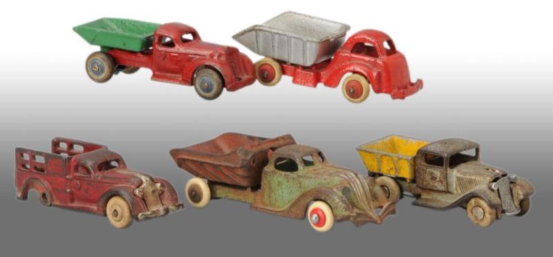 Appraisal: Lot of Cast Iron Dump Truck Toys Description Various makers