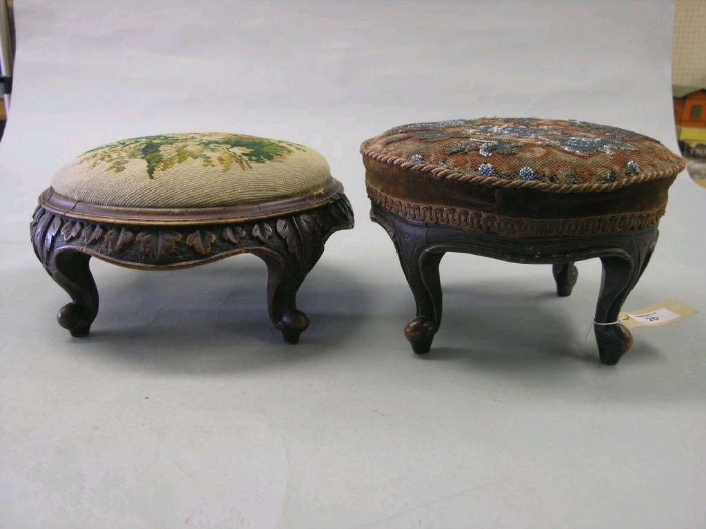 Appraisal: Two early Victorian walnut footstools each circular carved detail one