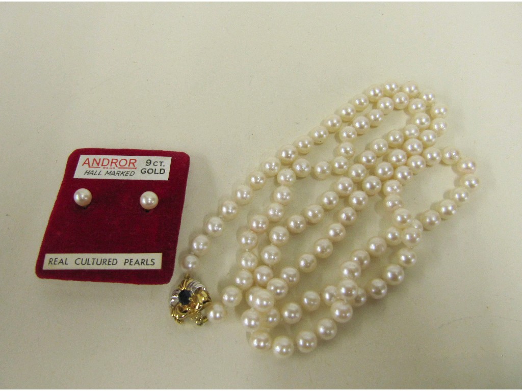 Appraisal: String of cultured pearls with ct gold sapphire set clasp