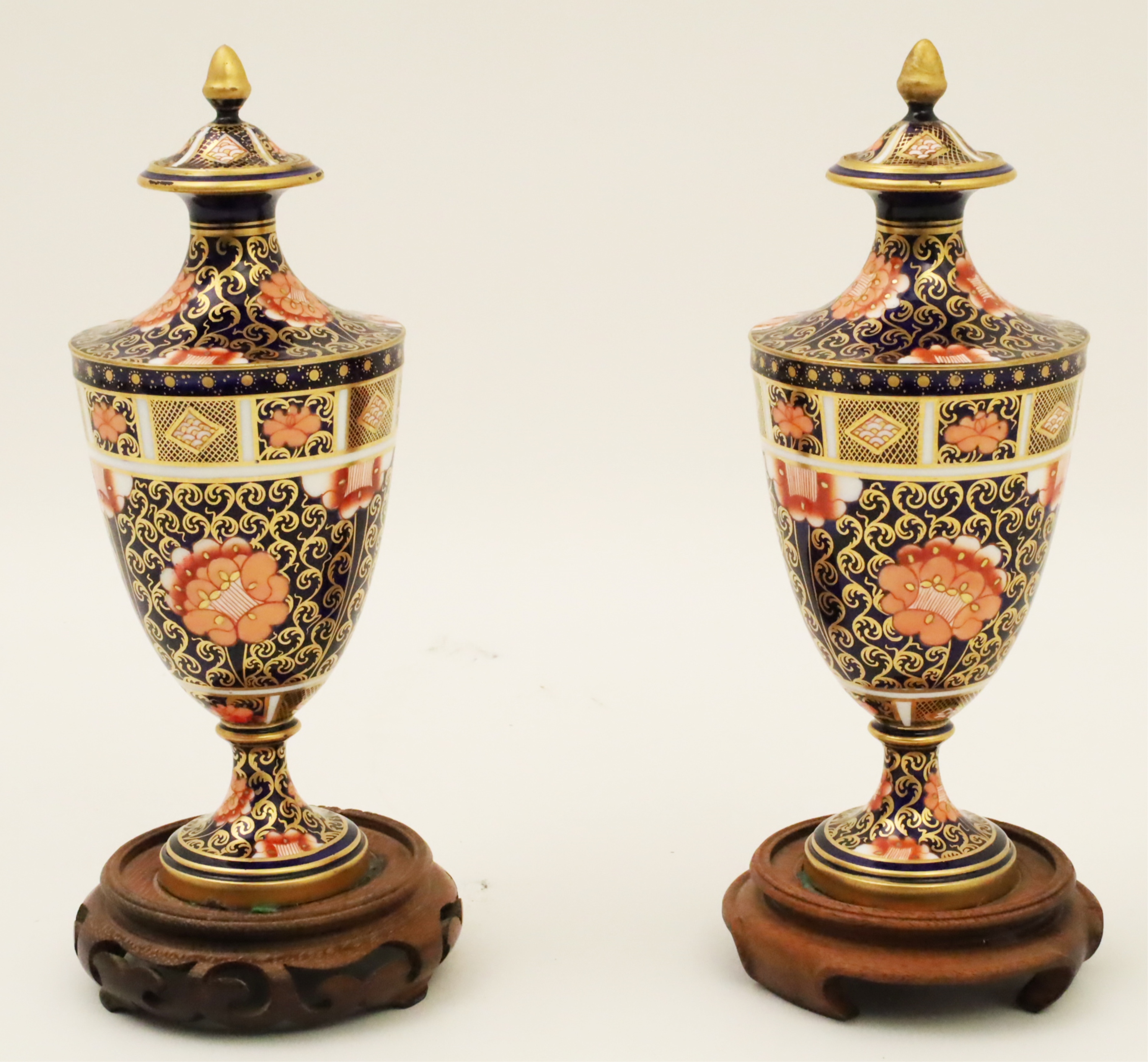 Appraisal: PAIR OF ROYAL CROWN DERBY CAPPED URNS Pair of Royal