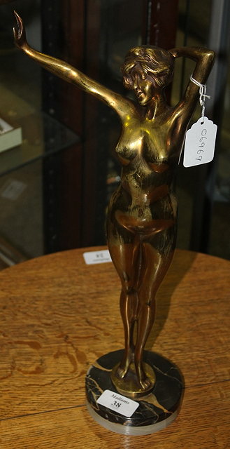 Appraisal: AN ART DECO GILT BRONZE FEMALE FIGURE with arm outstretched