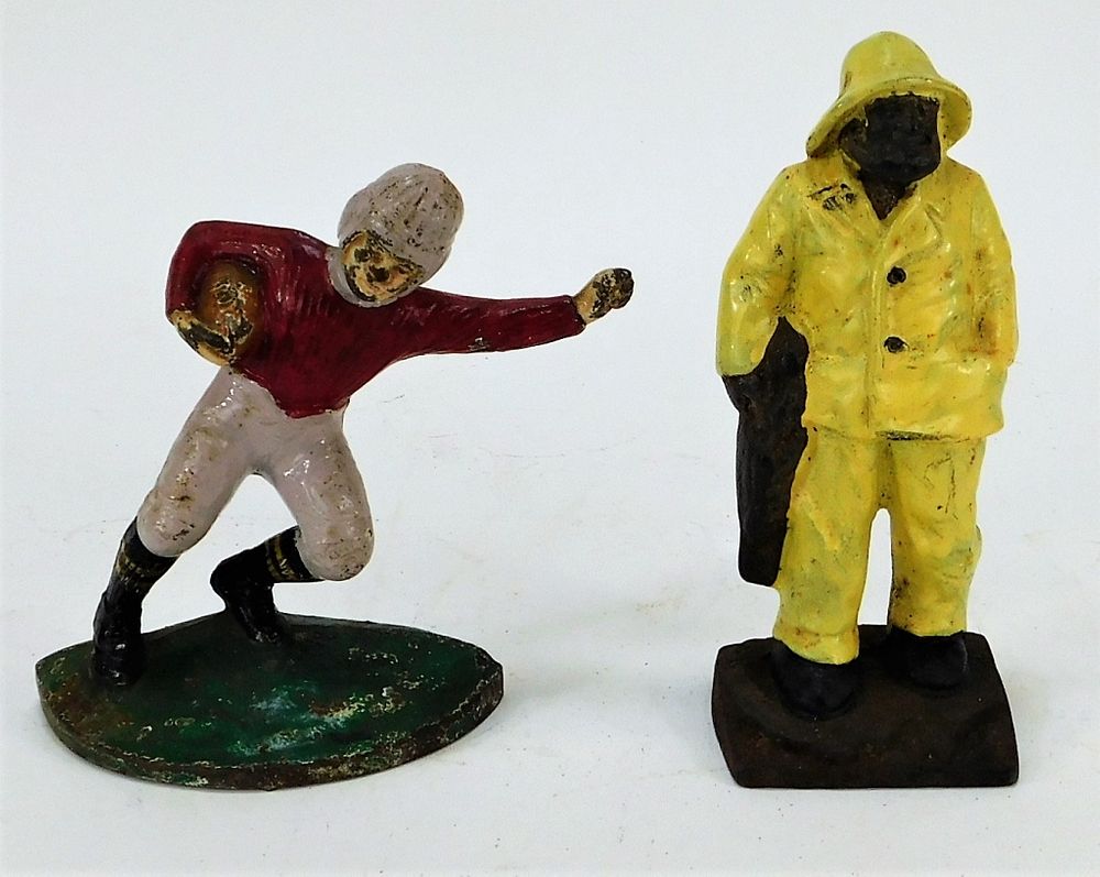 Appraisal: Antique Cast Iron Football Player Fisherman Toys United States Early